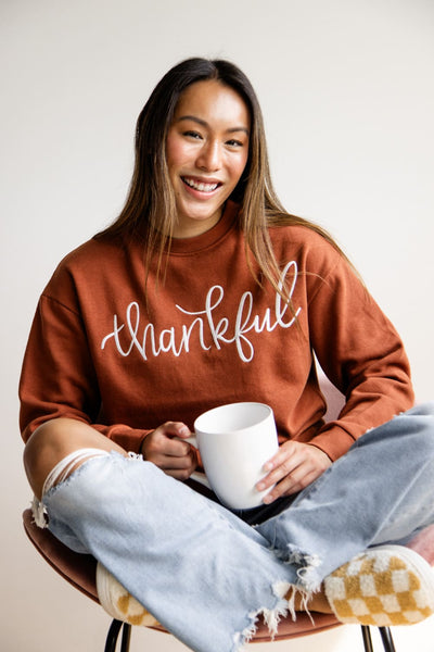 004-1897-Active-Thankful-Graphic-Fleece-Sweatshirt-for-Women-in-Orange-GT052-THANKFUL-RUST_grande.jpg 1897 Active Thankful Embroidered Fleece Sweatshirt for Women in Orange