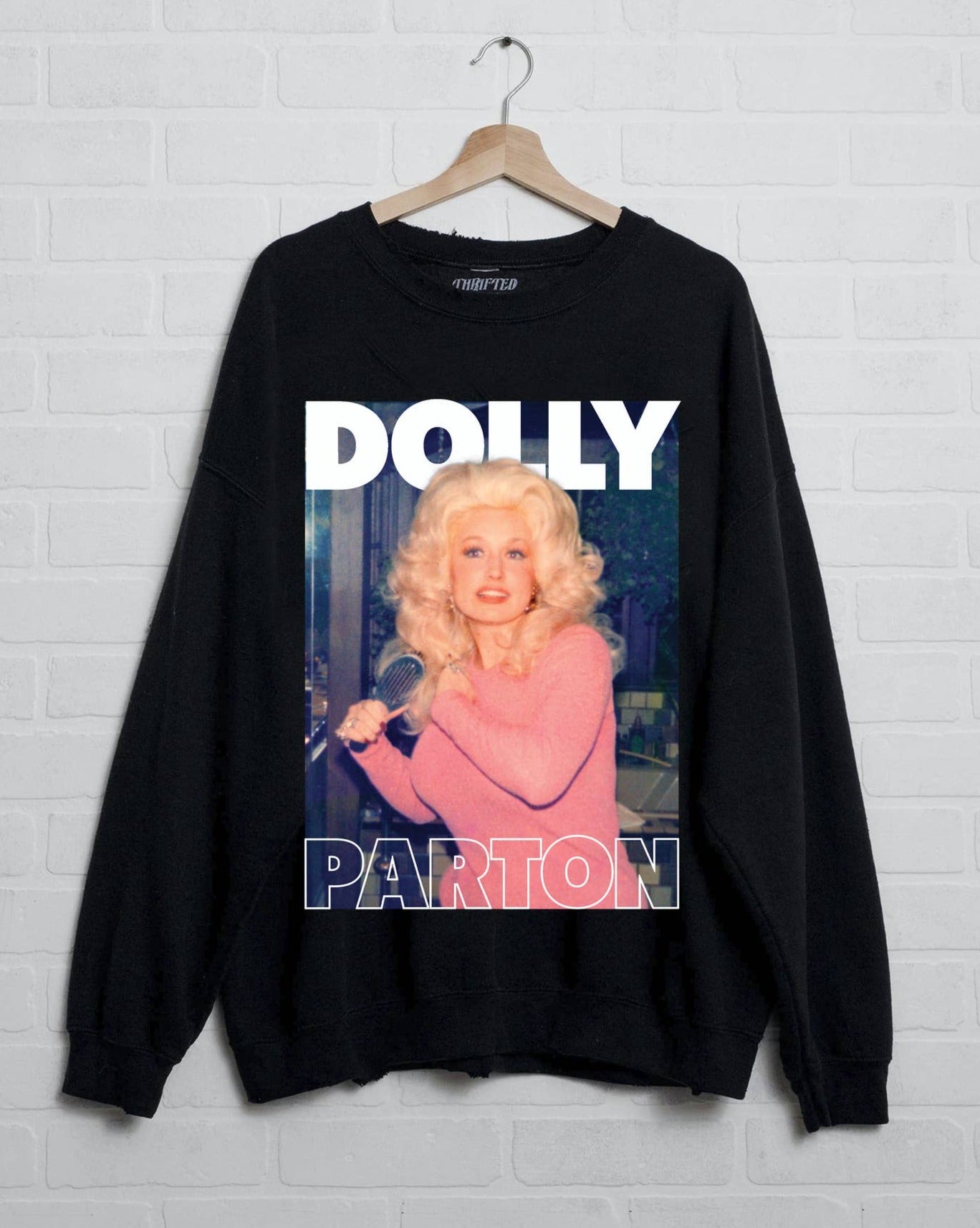 fb28fbddc688578d6f7bb98154869cce61fe640d57bba06280f87b47ece129e1.jpg Dolly Parton in Pink Black Licensed Graphic Sweatshirt